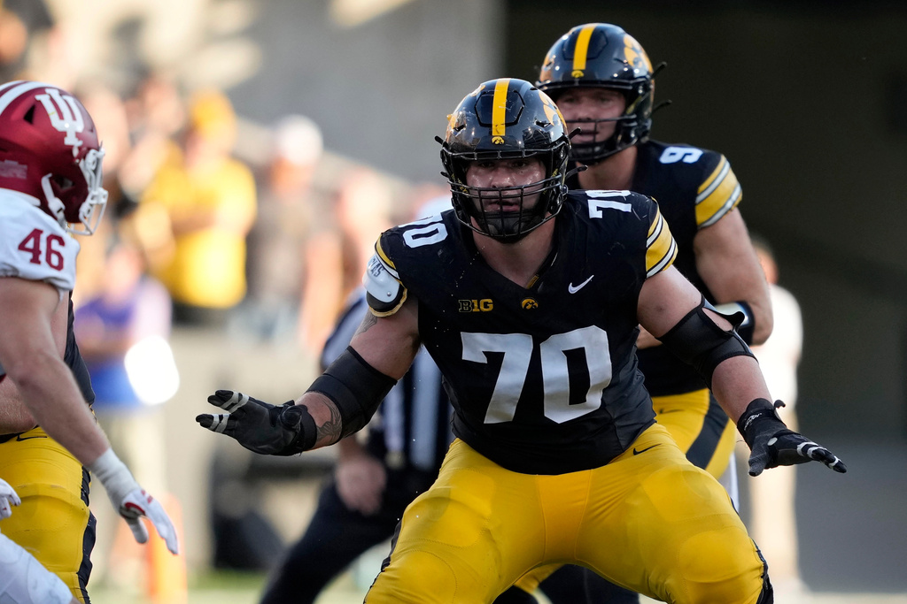 FILE - Iowa offensive lineman Beau Stephens (70) looks to make a block during the second half of an NCAA college football game against Indiana, Saturday, Sept. 27, 2025, in Iowa City, Iowa. (AP Photo/Charlie Neibergall, File)