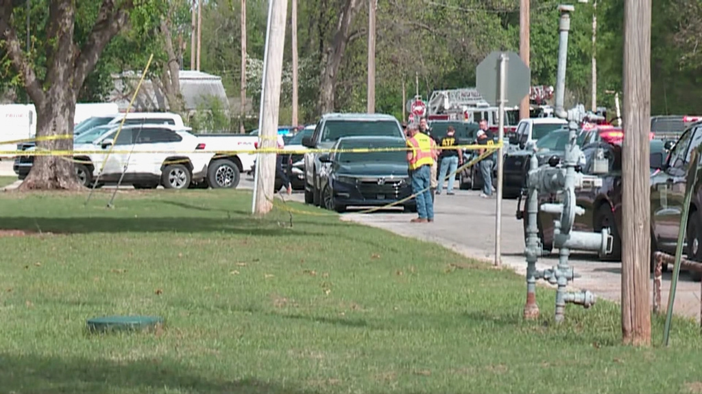 In this image taken from video provided by Oklahoma television station KFOR, authorities block off an area following a shooting inside a high school, Tuesday, April 7, 2026, in Pauls Valley, Okla. (KFOR via AP)