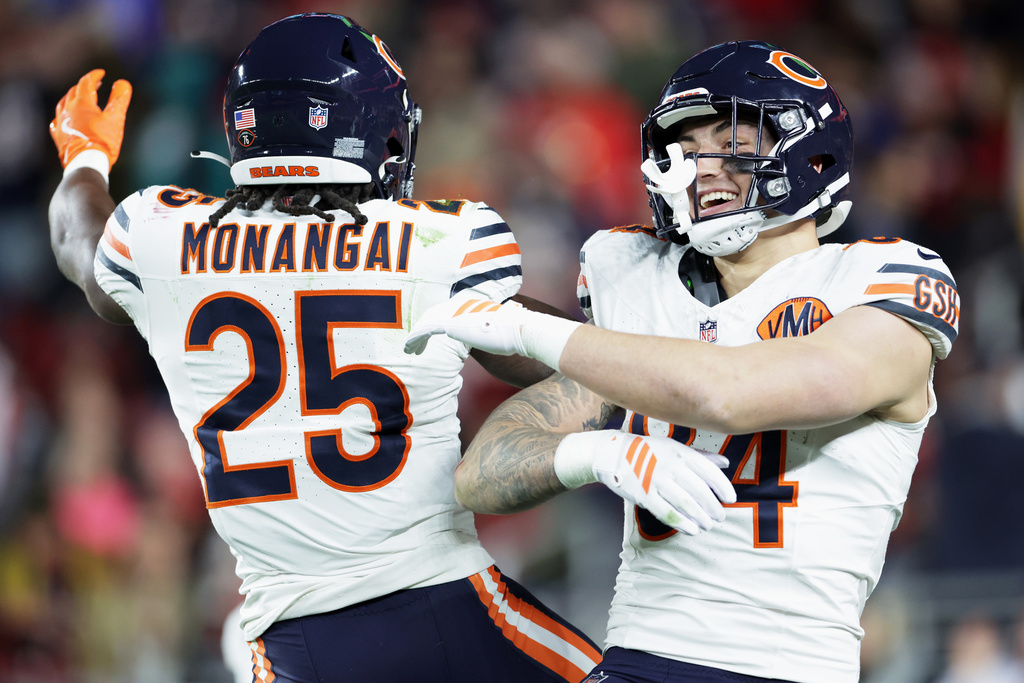 Chicago Bears' Colston Loveland celebrates his touchdown catch with Kyle Monangai during the first half of an NFL football game the San Francisco 49ers in Santa Clara, Calif., Sunday, Dec. 28, 2025. (Scott Strazzante/San Francisco Chronicle via AP)