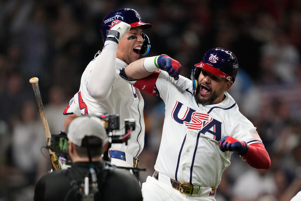 United States designated hitter Kyle Schwarber, right, celebrates with Aaron Judge after hitting a home run during the fifth inning of a World Baseball Classic game against Britain, Saturday, March 7, 2026, in Houston. (AP Photo/Ashley Landis)