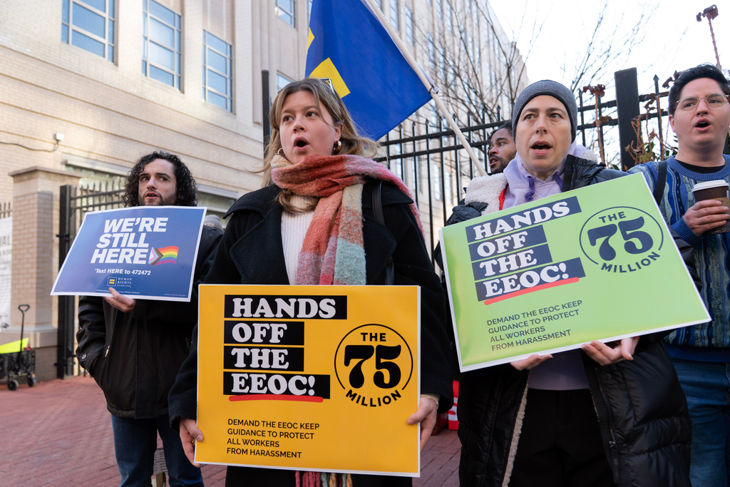 Members of the 75 Million coalition rally outside of the Equal Employment Opportunity Commission (EEOC) agency's headquarters Thursday, Jan. 22, 2026, in Washington, opposing the Equal Employment Opportunity Commission's move to rescind its 2024 Enforcement Guidance on Harassment in the Workplace. (AP Photo/Jose Luis Magana)