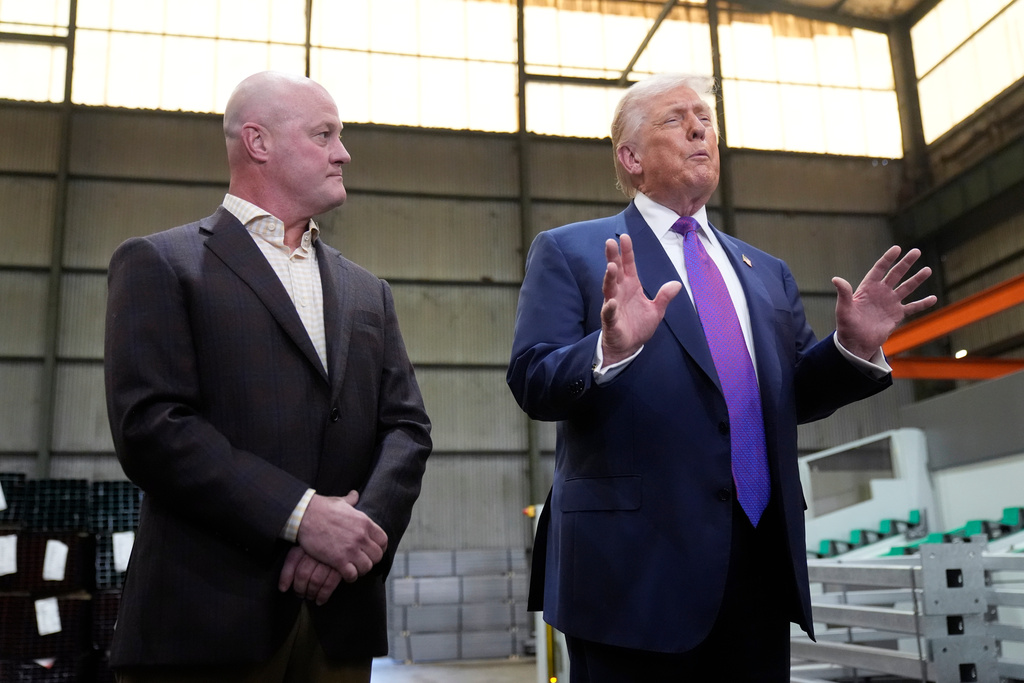 President Donald Trump speaks as. President of Coosa Steel Andrew Saville listens during a visit to Coosa Steel Corporation in Rome, Ga., Thursday, Feb. 19, 2026. (AP Photo/Mark Schiefelbein)