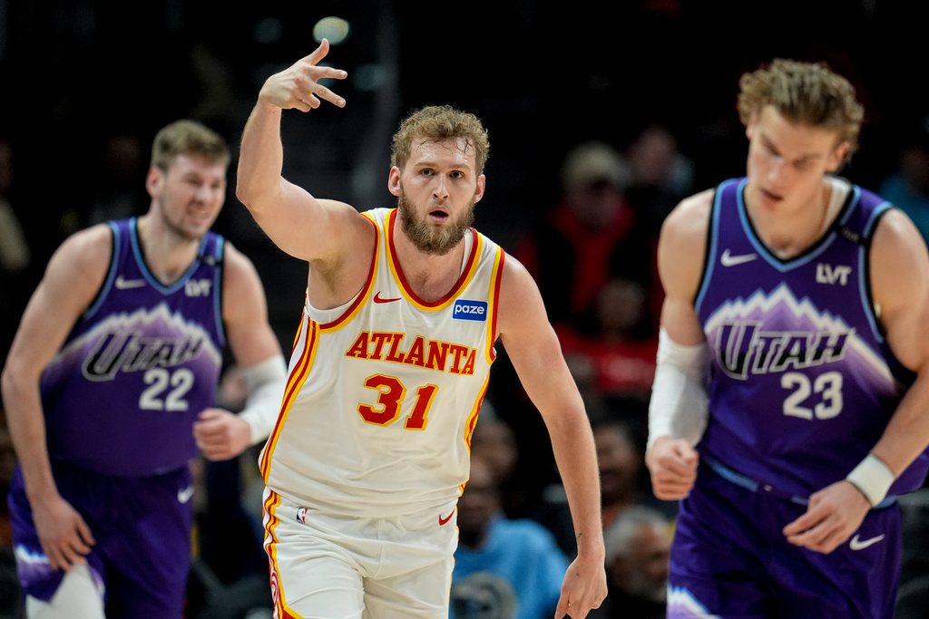Atlanta Hawks center Jock Landale (31) celebrates his three-poing shot against the Utah Jazz during the first half of an NBA basketball game, Thursday, Feb. 5, 2026, in Atlanta. (AP Photo/Mike Stewart)