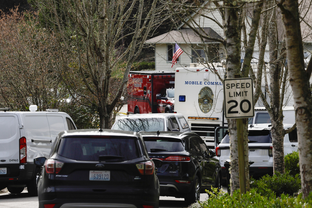Authorities investigate the scene after reports that a man fatally stabbed multiple people Tuesday, Feb. 24, 2026, in Gig Harbor, Wash. (AP Photo/John Froschauer)