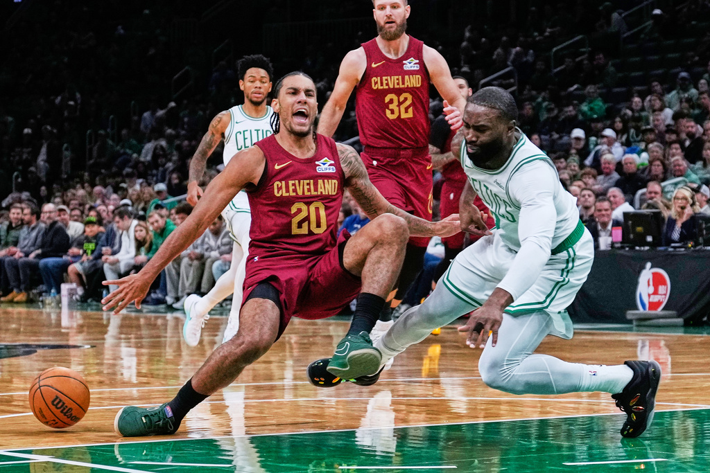 Cleveland Cavaliers forward Jaylon Tyson (20) collides with Boston Celtics forward Jaylen Brown (7) during the first half of an NBA basketball game, Wednesday, Oct. 29, 2025, in Boston. (AP Photo/Charles Krupa)