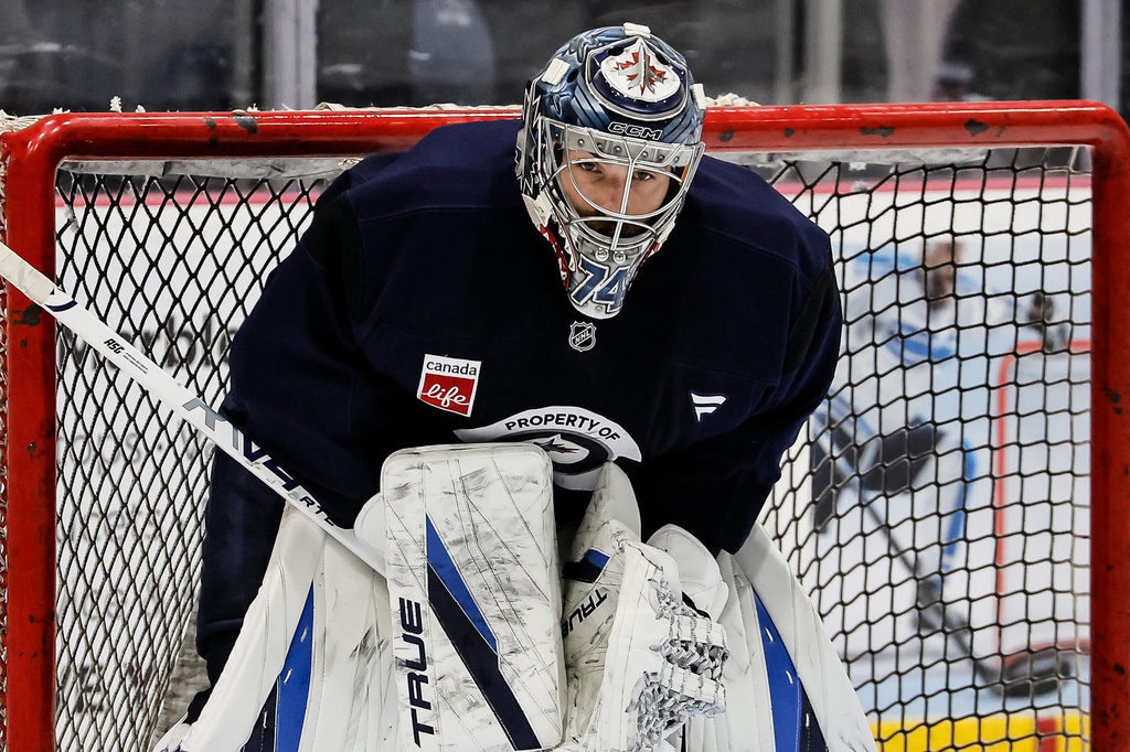 Winnipeg Jets' goaltender Stuart Skinner (74) watches the action during the NHL hockey team's training camp in Winnipeg, Manitoba, Thursday, Sept. 17, 2026. (John Woods/The Canadian Press via AP)