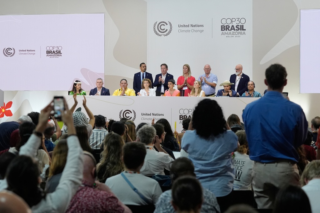 Irene Velez Torres, minister of environment and sustainable development of Colombia, front center, speaks during a session surrounded by other representatives from several countries as they discuss transitioning away from fossil fuels at the COP30 U.N. Climate Summit, Friday, Nov. 21, 2025, in Belem, Brazil. (AP Photo/Fernando Llano)