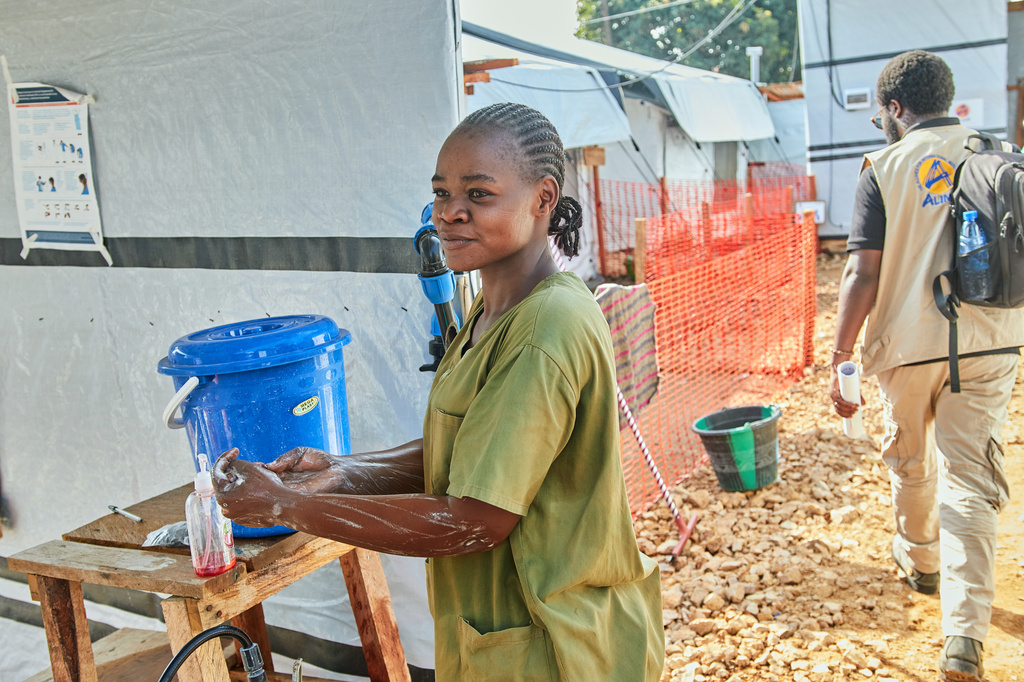 Health workers stand at the Evangelical Medical Center, in Bunia, eastern Congo, Friday, July 3, 2026, where Ebola clinical trials are scheduled to take place. (AP Photo/Dirole Lotsima Dieudonne)