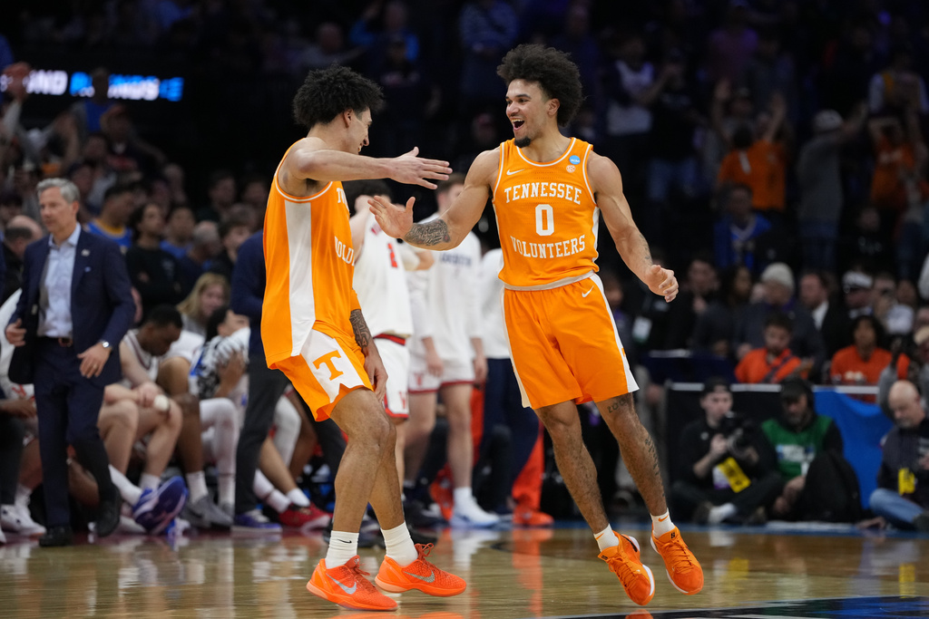 Tennessee's Bishop Boswell, left, and Ja'kobi Gillespie celebrate after Tennessee beat Virginia in the second round of the NCAA college basketball tournament, Sunday, March 22, 2026, in Philadelphia. (AP Photo/Matt Slocum)