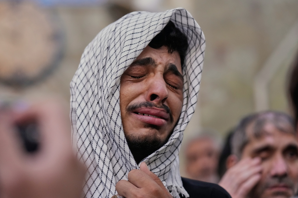 A Irani Shiite Muslim weeps as he prays inside the holy shrine of Imam Abbas ahead of the Arbaeen festival in Karbala, Iraq, Sunday, Aug. 2, 2026. (AP Photo/Hadi Mizban)
