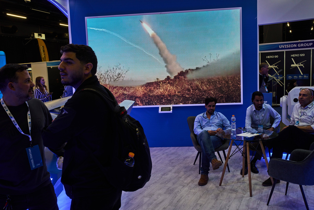 Visitors attend a defense industry exhibition in Tel Aviv, Israel, Tuesday, Feb. 17, 2026. (AP Photo/Oded Balilty)