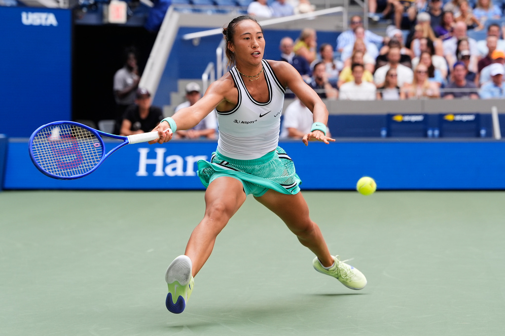 Qinwen Zheng, of China, returns the ball to Elena Rybakina, of Kazakhstan, during the quarterfinal round of the U.S. Open tennis championships, Wednesday, Sept. 9, 2026, in New York. (AP Photo/Seth Wenig)