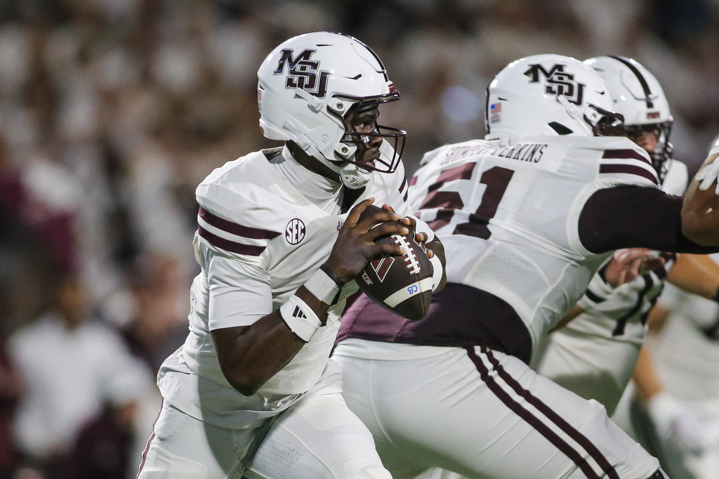 Mississippi State quarterback Kamario Taylor, left, looks to pass downfield against Missouri during the first half of an NCAA college football game in Starkville, Miss., Saturday, Sept. 26, 2026. (AP Photo/James Pugh)