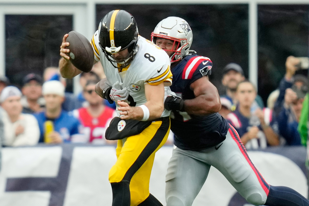 New England Patriots' Elijah Ponder, right, sacks Aaron Rodgers during the second half of an NFL football game in Foxborough, Mass., Sunday, Sept. 20, 2026. (AP Photo/Charles Krupa)
