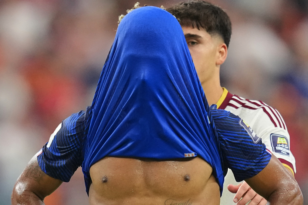 France's Desire Doue covers his face after his side's lost against in a World Cup semifinal soccer match in Arlington, Texas, near Dallas, Tuesday, July 14, 2026. (AP Photo/Julio Cortez)