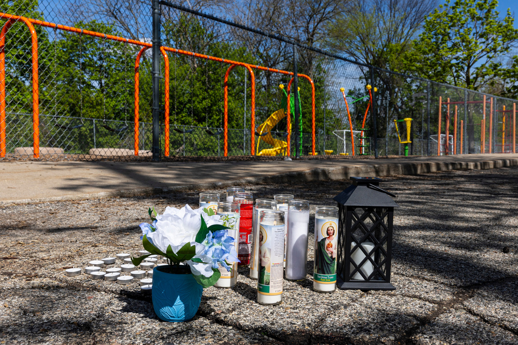 A makeshift memorial set up at the scene of a double homicide outside Southwest Elementary School in Grand Rapids, Mich. Wednesday, May 6, 2025. (Joel Bissel/Kalamazoo Gazette via AP)