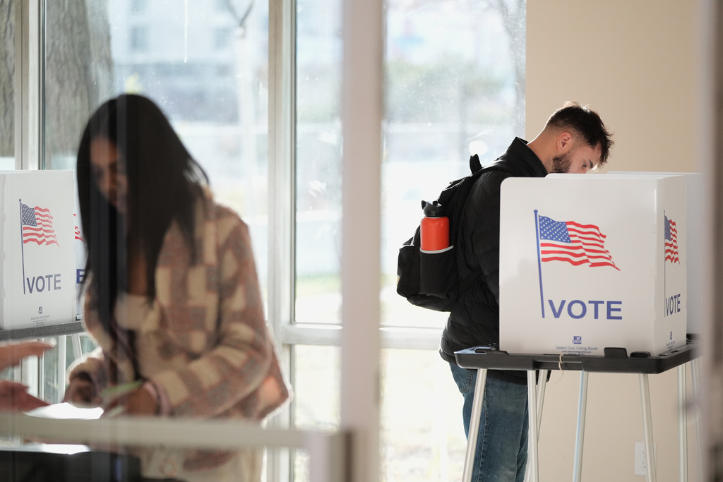 People vote at the Horatio Williams Foundation in downtown Detroit, Tuesday, Nov. 4, 2025. (AP Photo/Ryan Sun)