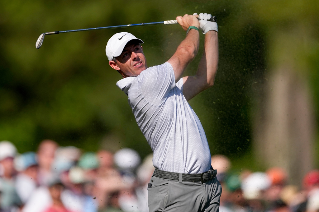 Rory McIlroy, of Northern Ireland, watches his tee shot on the 12th hole during the second round of the Masters golf tournament at the Augusta National Golf Club, Friday, April 10, 2026, in Augusta, Ga. (AP Photo/Eric Gay)