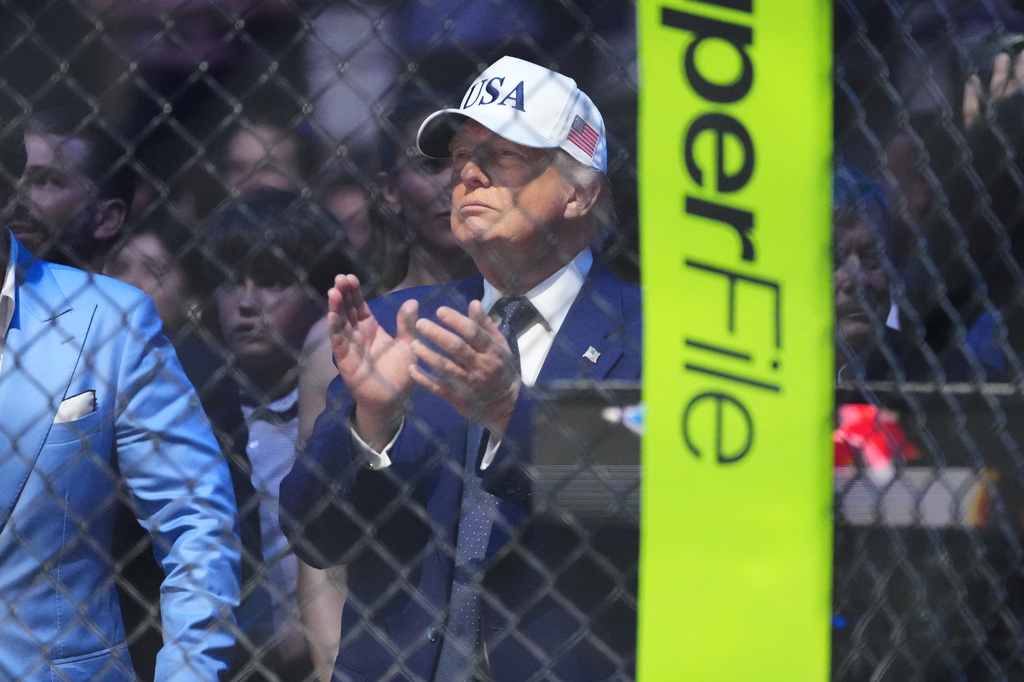 President Donald Trump applauds after Justin Gaethje defeated Ilia Toupruia in the lightweight championship bout at UFC Freedom 250 on the South Lawn of the White House, Monday, June 15, 2026, in Washington. (AP Photo/Alex Brandon)