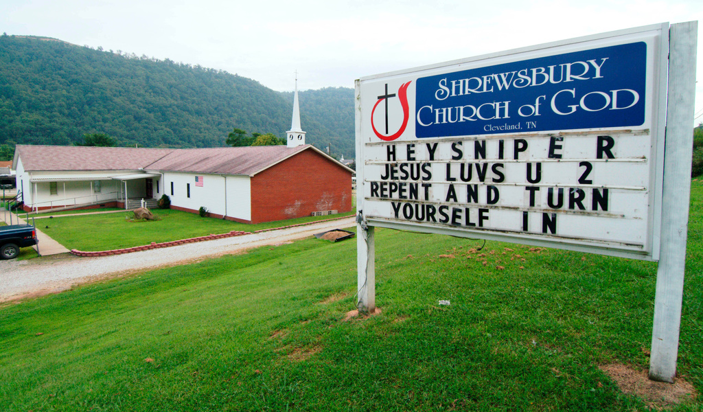 FILE — A sign in front of the Shrewsbury Church of God in Shrewsbury, W.Va., shown, Aug. 22, 2003, includes a message concerning three fatal shootings in the Charleston, W.Va.-area. (AP Photo/Bob Bird, File)