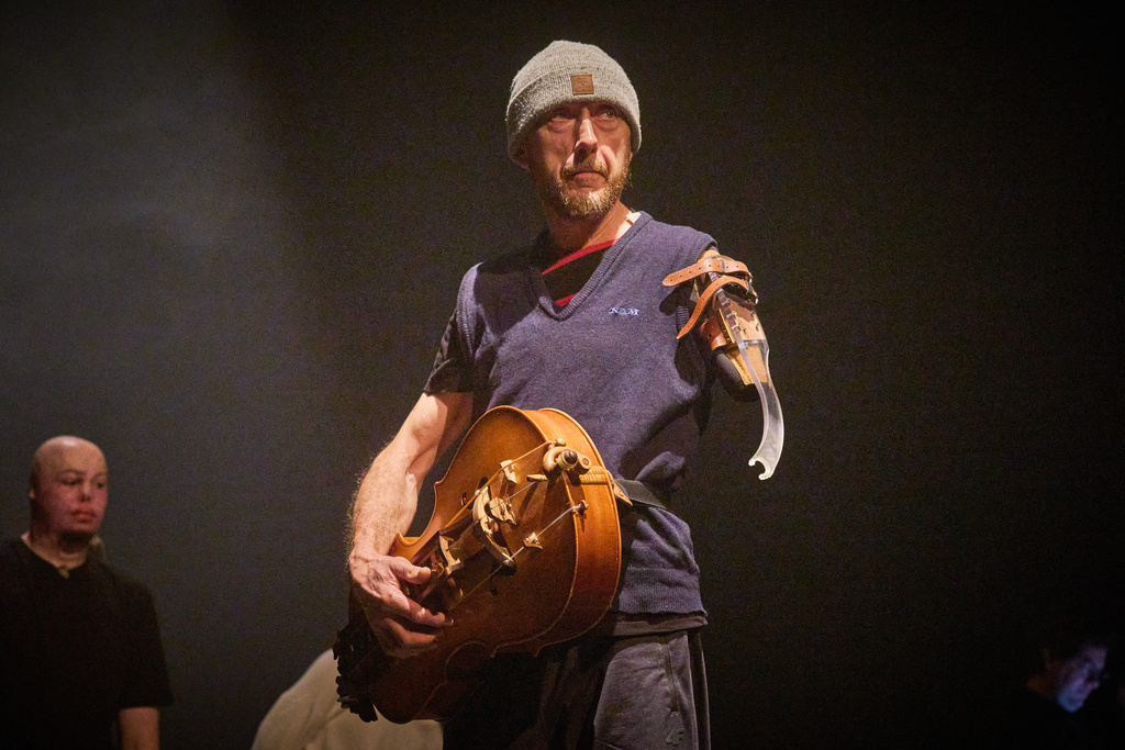 Taras Kozuk, a war veteran who sustained severe injuries in combat during Russia's full-scale invasion in Ukraine, plays the hurdy-gurdy, a traditional musical instrument, during a rehearsal in Kyiv, Ukraine, Thursday, Feb. 19, 2026. (AP Photo/Efrem Lukatsky)