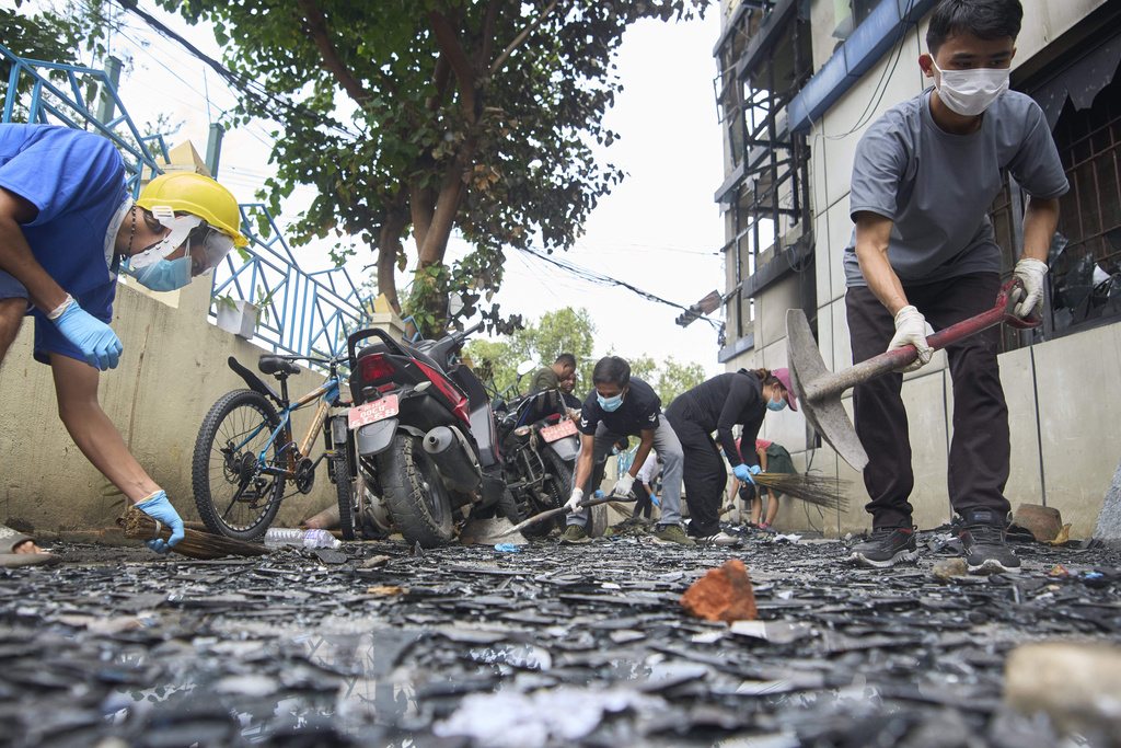 Volunteers from Maitry Nepal clean police station which was vandalized during anti-corruption protests sparked by a short-lived social media ban in Kathmandu, Nepal, Saturday, Sept. 13, 2025. (AP Photo/Niranjan Shrestha)