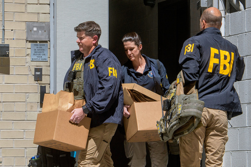 FILE - FBI agents carry boxes from former National Security Advisor John Bolton's office in Washington, Aug. 22, 2025. (AP Photo/Rod Lamkey, Jr., File) FILE - FBI agents carry boxes from former National Security Advisor John Bolton's office in Washington, Aug. 22, 2025. (AP Photo/Rod Lamkey, Jr., File)