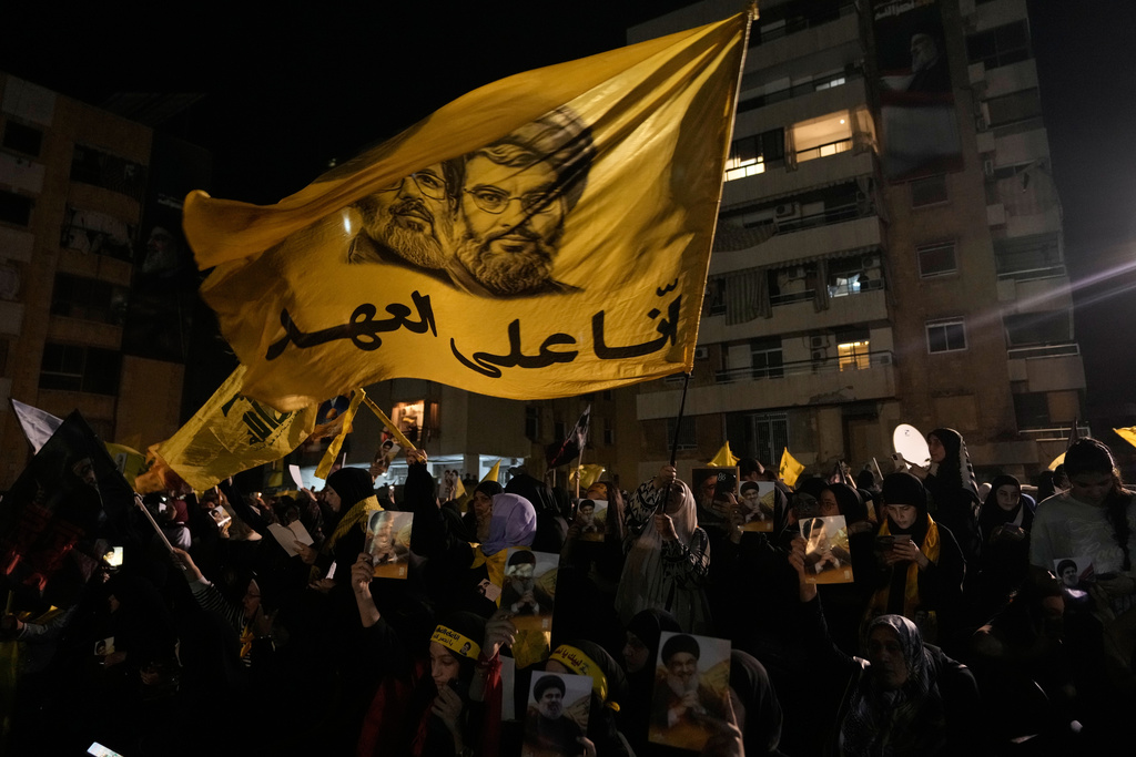 People gather at the site where Hezbollah leader Hassan Nasrallah was killed in Israeli airstrikes on Sept. 27, 2024, a day before the first anniversary of his death, in the Haret Hreik suburb south of Beirut, Lebanon, Friday, April 26, 2025. (AP Photo/Hassan Ammar)