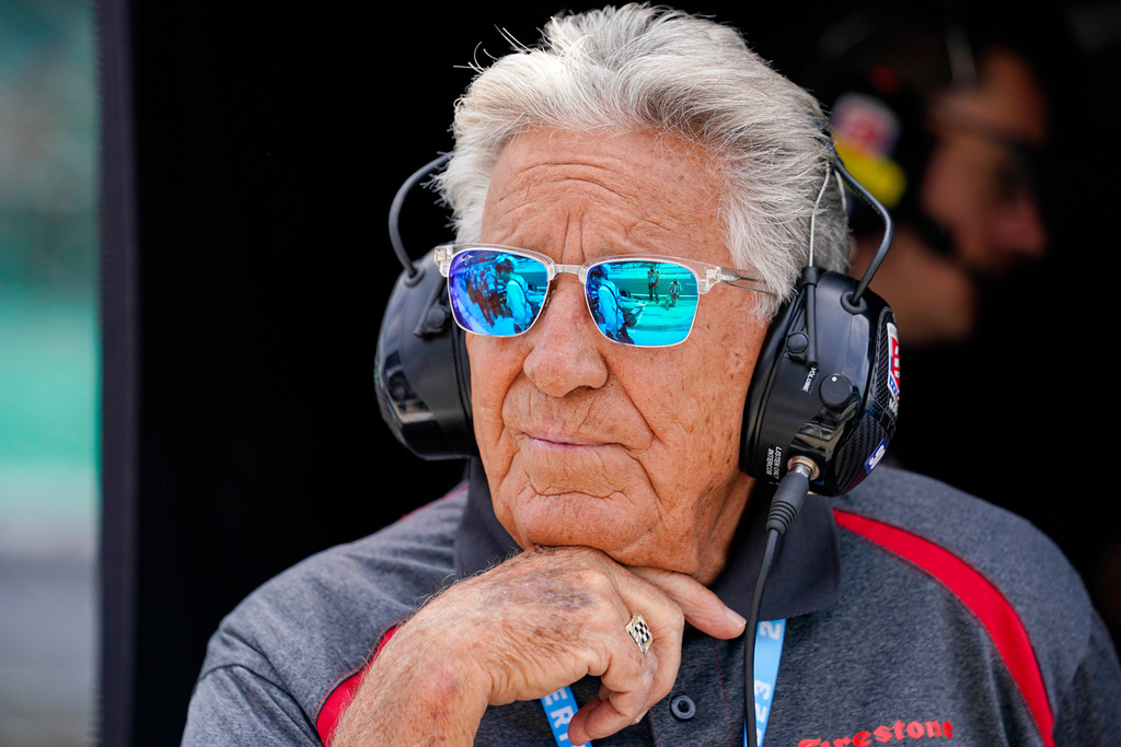 FILE - 1969 Indy 500 champion Mario Andretti watches from his grandson Marco Andretti's pit area during practice for the Indianapolis 500 auto race at Indianapolis Motor Speedway in Indianapolis, May 19, 2023. (AP Photo/Michael Conroy, File)