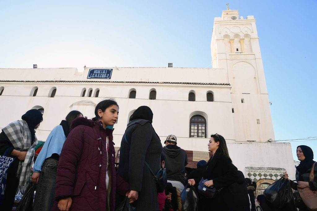 People stock up on food at a market in Algiers, Algeria, Thursday, Feb. 17, 2026, before the start of the holy month of Ramadan. (AP Photo/Fateh Guidoum)