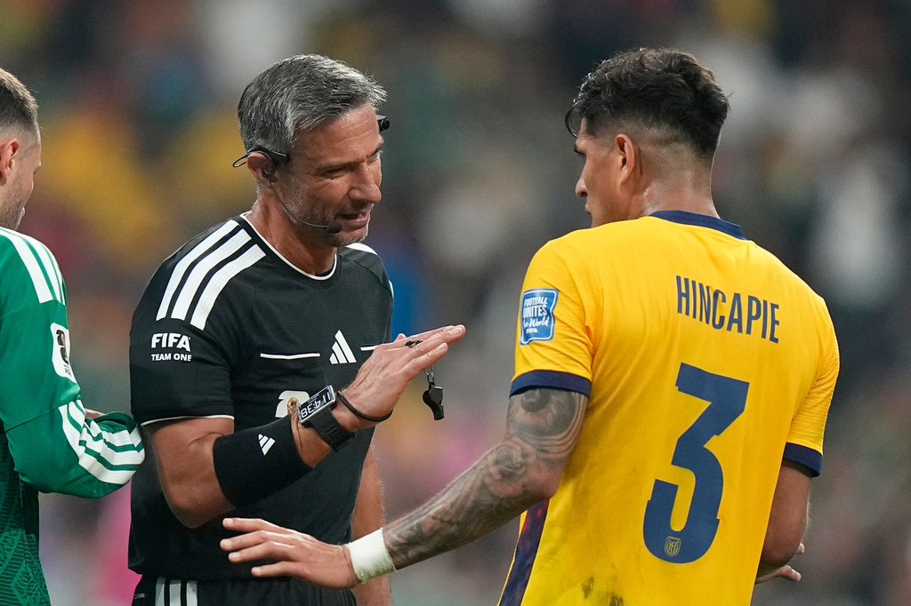Referee Slavko Vincic, of Slovenia, talks to Ecuador's Piero Hincapie (3) during the World Cup round of 32 soccer match between Mexico and Ecuador in Mexico City, Tuesday, June 30, 2026. (AP Photo/Fernando Llano)