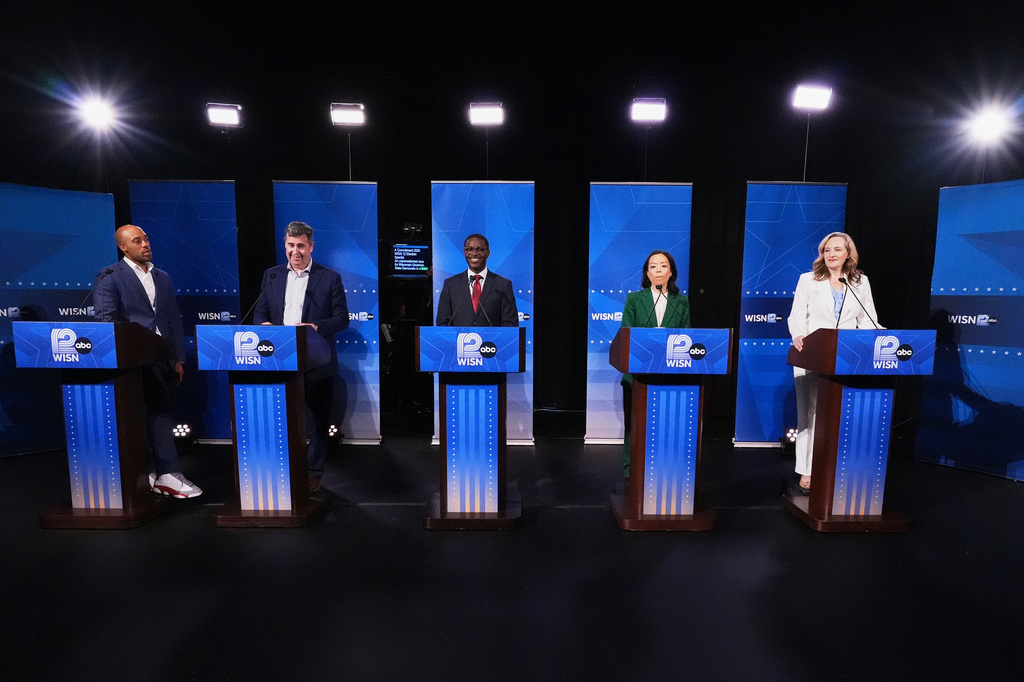 From left, Democratic gubernatorial candidates Mandela Barnes, Joel Brennan, David Crowley, Francesca Hong and Kelda Roys attend a primary debate in Milwaukee, Tuesday, July 28, 2026. (AP Photo/Nam Y. Huh)