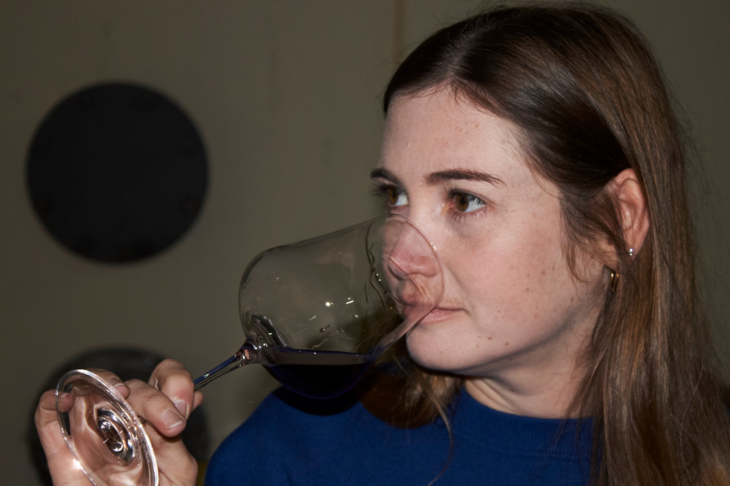 Natasha Jacka evaluates a glass of wine during the period it matures in oak in Cape Town, South Africa, Thursday, June 4, 2026. (AP Photo/Neil Shaw)