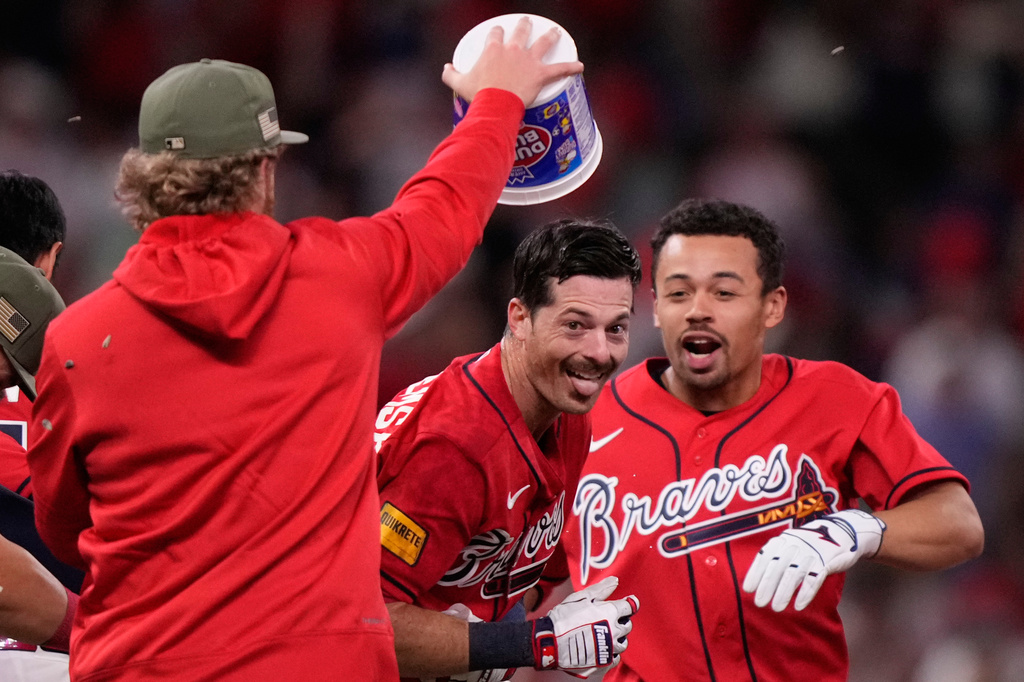 Atlanta Braves' Mike Yastrzemski (18) celebrates in the 10th inning of a baseball game against the Boston Red Sox Friday, May 15, 2026, in Atlanta. (AP Photo/Brynn Anderson)