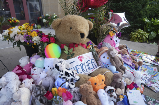 Items including dolls are placed at a memorial at Annunciation Catholic Church after Wednesday's school shooting, Thursday, Aug. 28, 2025, in Minneapolis. (AP Photo/Abbie Parr) Items including dolls are placed at a memorial at Annunciation Catholic Church after Wednesday's school shooting, Thursday, Aug. 28, 2025, in Minneapolis. (AP Photo/Abbie Parr)