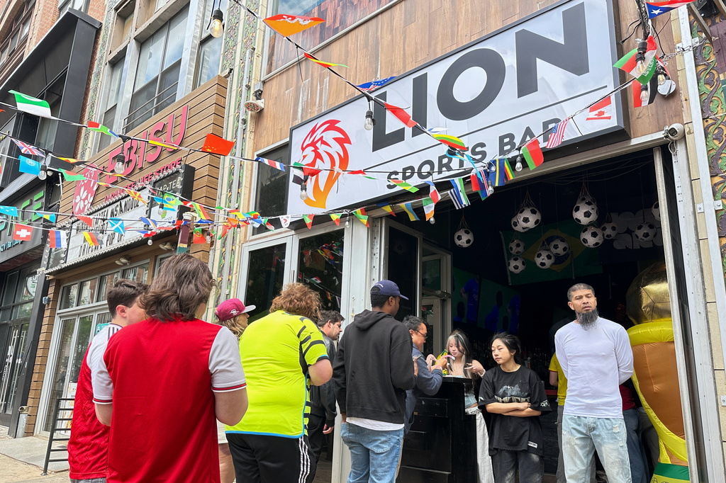 Fans arrive to watch a Champion league soccer match between Arsenal and Paris Saint-Germain at the Lion Sports Bar, Saturday, May 30, 2026, in Philadelphia. (AP Photo/Tassanee Vejpongsa)