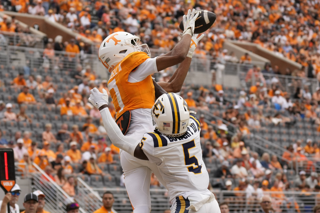 Tennessee wide receiver Chris Brazzell II (17) catches touchdown pass in the end zone over East Tennessee State defensive back Jimmy Bowdry (5) during the second half of an NCAA college football game Saturday, Sept. 6, 2025, in Knoxville, Tenn. (AP Photo/George Walker IV)