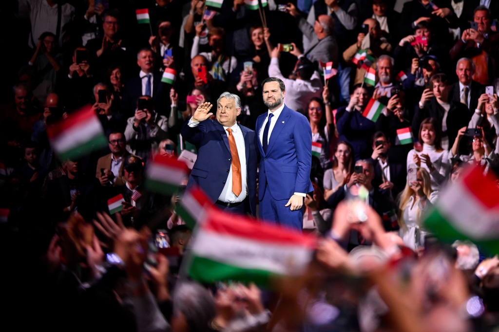 Hungary's Prime Minister Viktor Orban, left, and U.S. Vice President JD Vance wave to the audience at the end of a pre-election rally in Budapest, Hungary, Tuesday, April 7, 2026. (AP Photo/Denes Erdos)