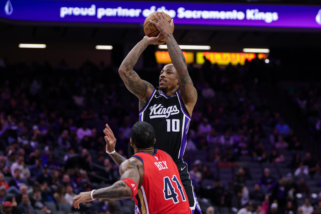 Sacramento Kings guard DeMar DeRozan (10) shoots over New Orleans Pelicans guard Saddiq Bey (41) during the second half of an NBA basketball game Thursday, March 5, 2026, in Sacramento, Calif. (AP Photo/Scott Marshall)