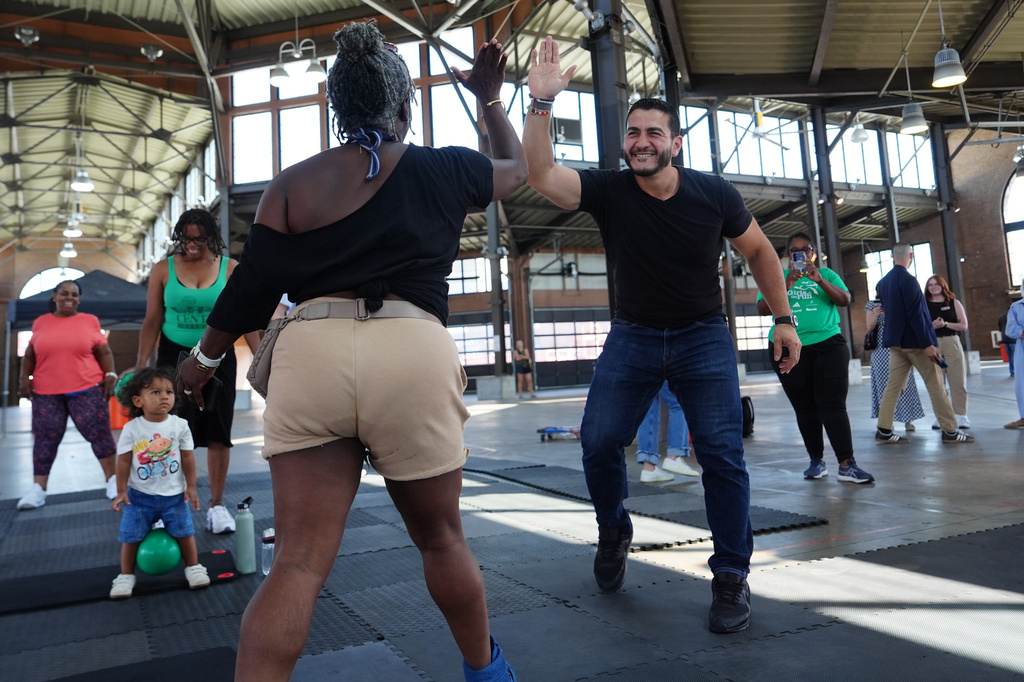 Abdul El-Sayed, a progressive candidate in the Democratic primary for U.S. Senate in Michigan, visits Eastern Market on election day, Tuesday, Aug. 4, 2026, in Detroit. (AP Photo/Julia Demaree Nikhinson)