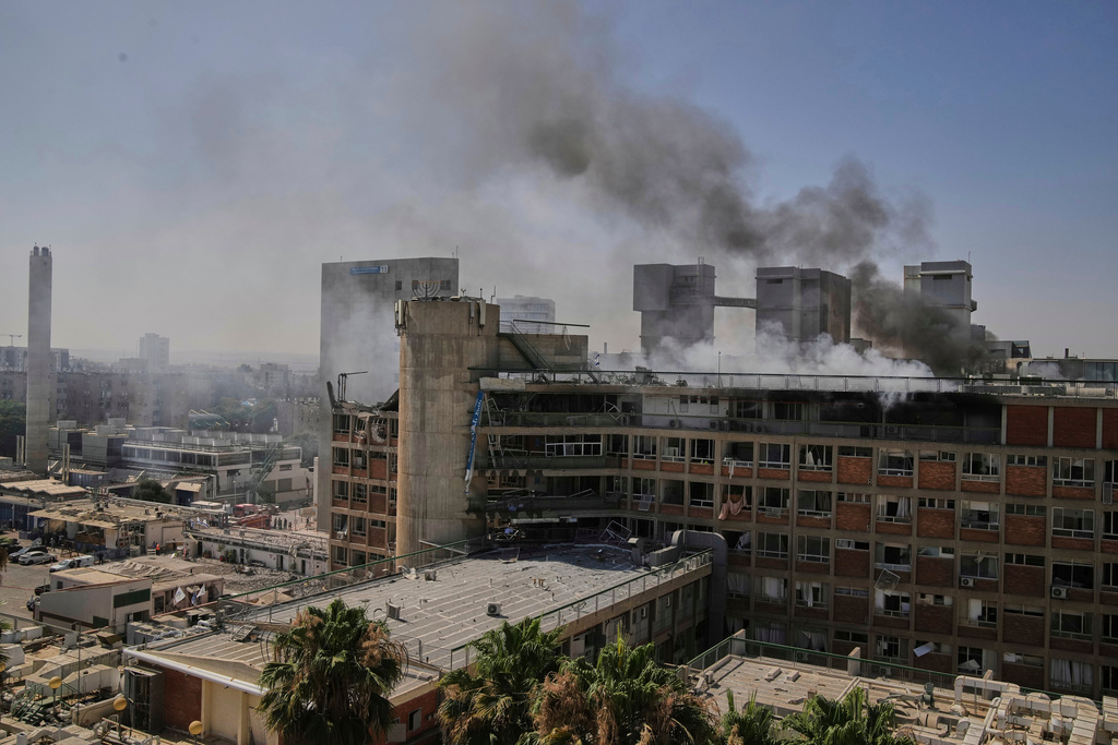 FILE - Smokes rises from a building of the Soroka hospital complex after it was hit by a missile fired from Iran in Beersheba, Israel, June 19, 2025. (AP Photo/Leo Correa, file)