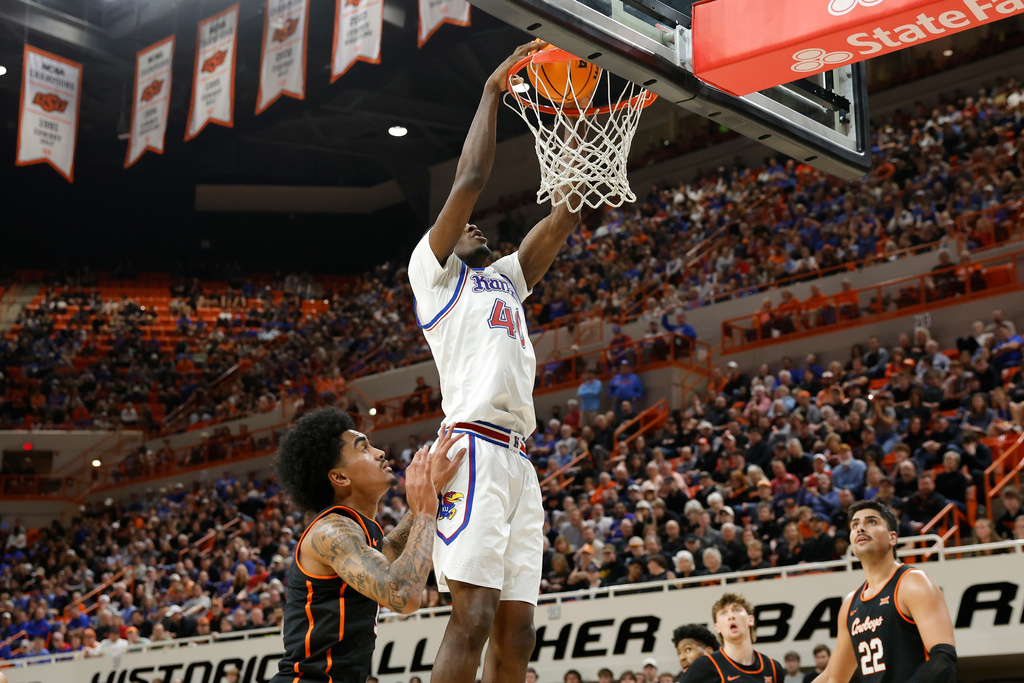 Kansas forward Flory Bidunga (40) dunks against Oklahoma State during the first half of an NCAA college basketball game Wednesday, Feb. 18, 2026, in Stillwater, Okla. (AP Photo/Alonzo Adams)