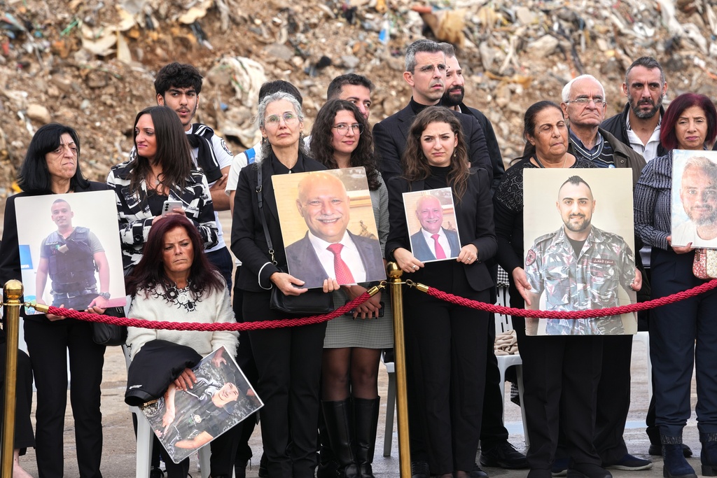Relatives of victims of the 2020 Beirut port explosion wait for the arrival of Pope Leo XIV at the site of the explosion in Beirut, Lebanon, Tuesday, Dec. 2, 2025. (AP Photo/Domenico Stinellis)