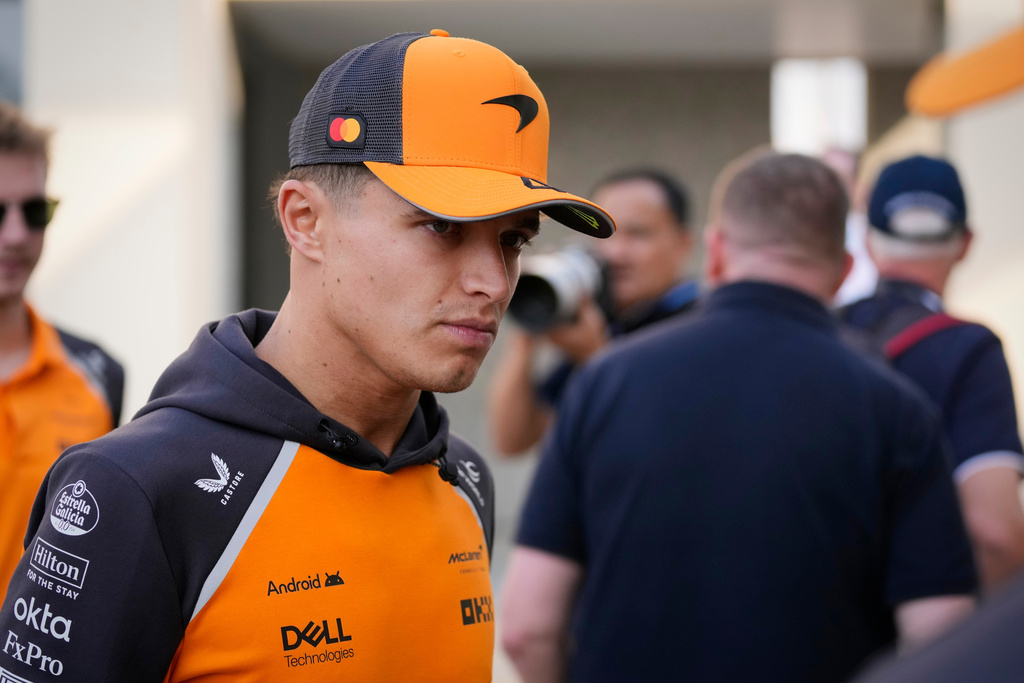 McLaren driver Lando Norris of Britain walks through the paddock at the Yas Marina Circuit ahead of the Abu Dhabi Grand Prix in Abu Dhabi, United Arab Emirates, Thursday, Dec. 4, 2025. (AP Photo/Darko Bandic)