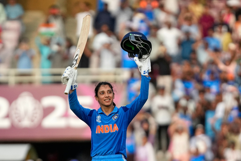 India's Smriti Mandhana celebrates her century during the ICC Women's Cricket World Cup cricket match between India and New Zealand at DY Patil Stadium in Navi Mumbai, India, Thursday, Oct. 23, 2025. (AP Photo/Rajanish Kakade)