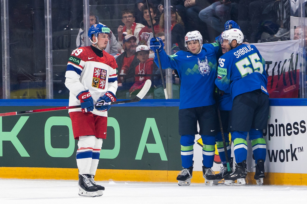 Slovenia's players celebrate after their goal during the 2026 IIHF Men's Ice Hockey World Championship preliminary round group B game between Slovenia and Czech Republic, in Fribourg, Switzerland, Saturday, May 16, 2026. (Cyril Zingaro/Keystone via AP)