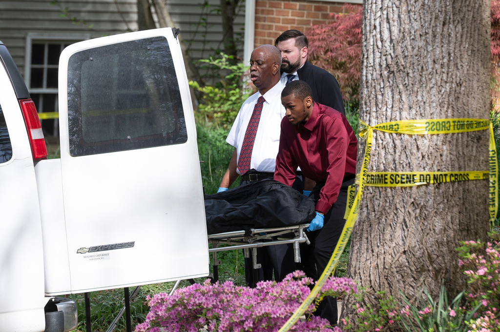 Fairfax County coroners remove a body from the home of former Virginia Lt. Gov. Justin Fairfax, in Annandale, Va., Thursday, April 16, 2026. (AP Photo/Cliff Owen)