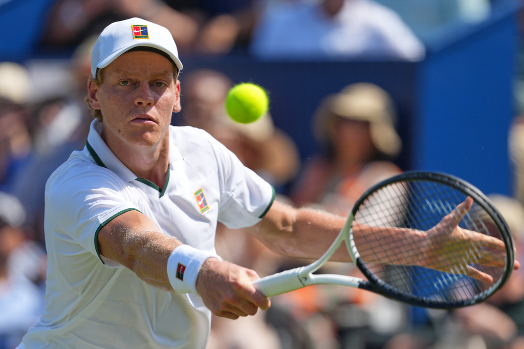 Jannik Sinner of Italy returns during a tennis exhibition match against Cameron Norrie of Great Britain at the Hurlingham Tennis Club in London, Wednesday, June 24, 2026.(AP Photo/Kirsty Wigglesworth)