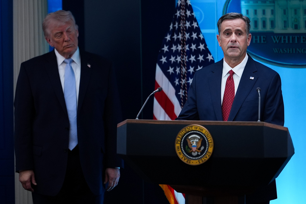 FILE - CIA Director John Ratcliffe, accompanied by President Donald Trump, speaks with reporters in the James Brady Press Briefing Room at the White House in Washington, April 6, 2026, File)