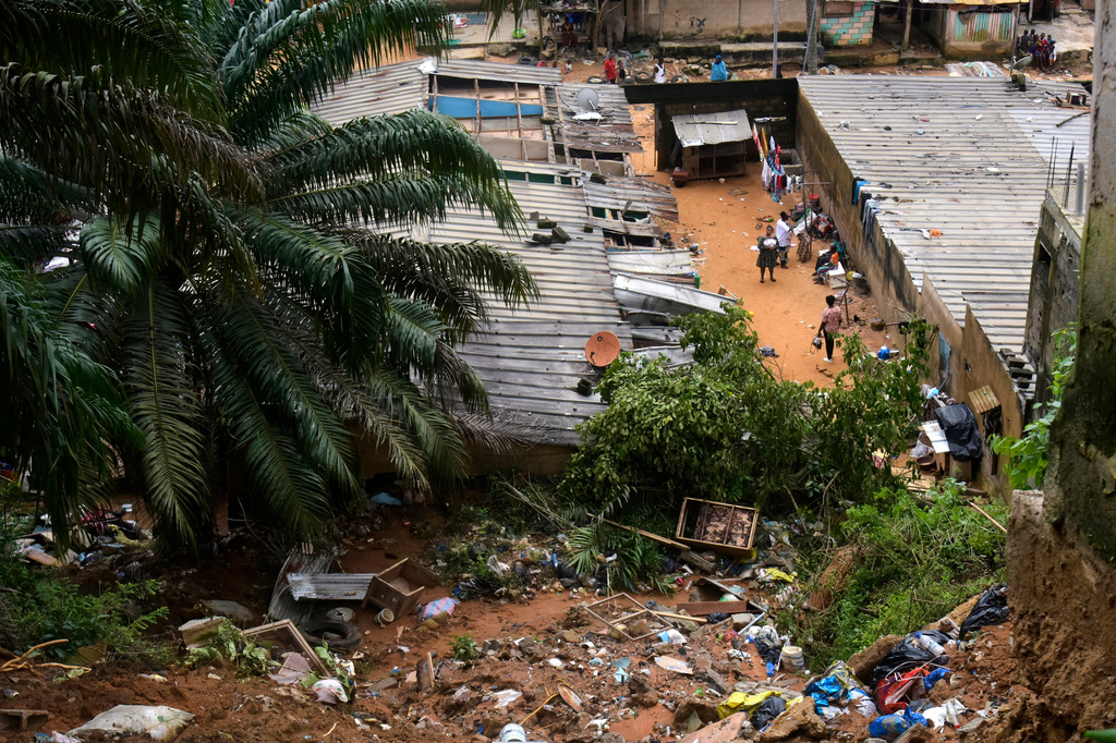 A view of the houses damaged by landslides in an informal settlement of Attecoube, in Abidjan, Ivory Coast, Tuesday, June 30, 2026. (AP Photo/Diomande Ble Blonde)